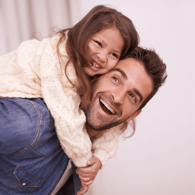 Lawyer Hunter Valley - Law Firm Hunter Valley - image is of a dad piggy backing his little girl